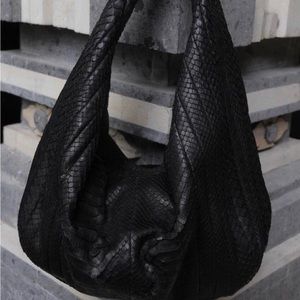 Authentic python skin with leather. Brand new condition. Worn twice.